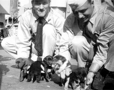 Unknown officers with Abigail Abbot&rsquo;s puppies.