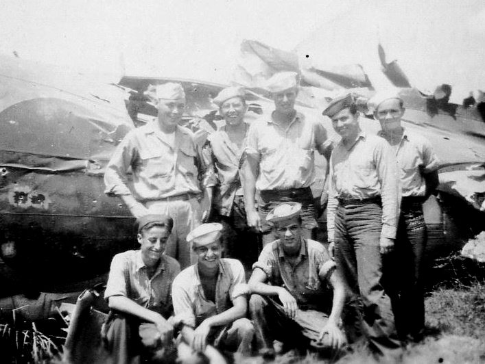 Destroyed Japanese Mitsubishi G4M-1 &ldquo;Betty&rdquo; bomber.<br>BACK ROW (L&rarr;R) H. Vincent, C. Angevine, UNK, C. Brannon, P. Withers.<br>FRONT ROW (L&rarr;R) W. Biers, M. Rupert, J. Beckham.